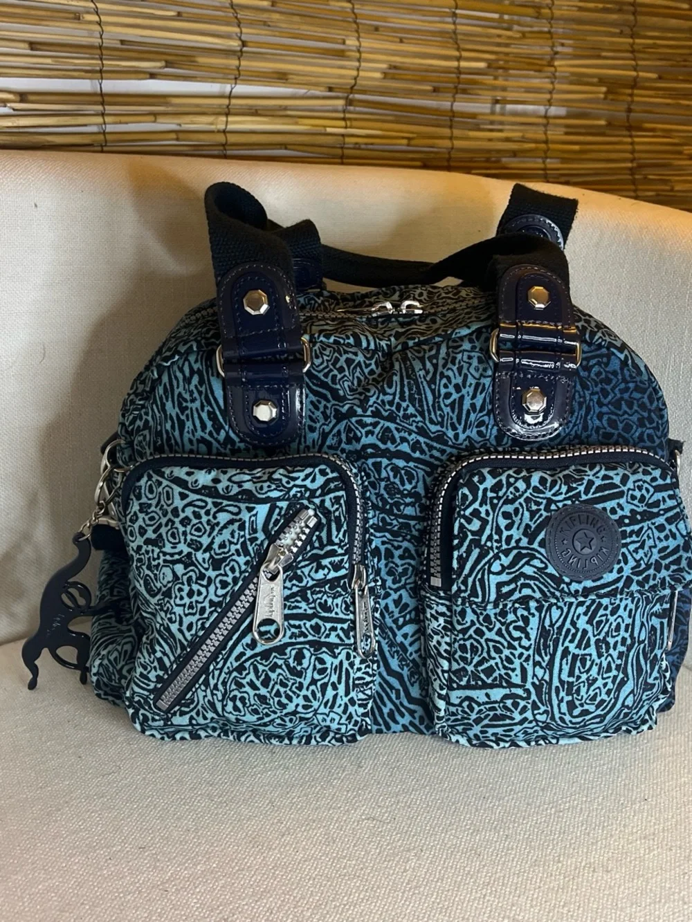 Teal and Black Patterned Shoulder Bag with Multiple Pockets